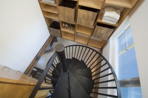 Spiral staircase and built in clothing storage.